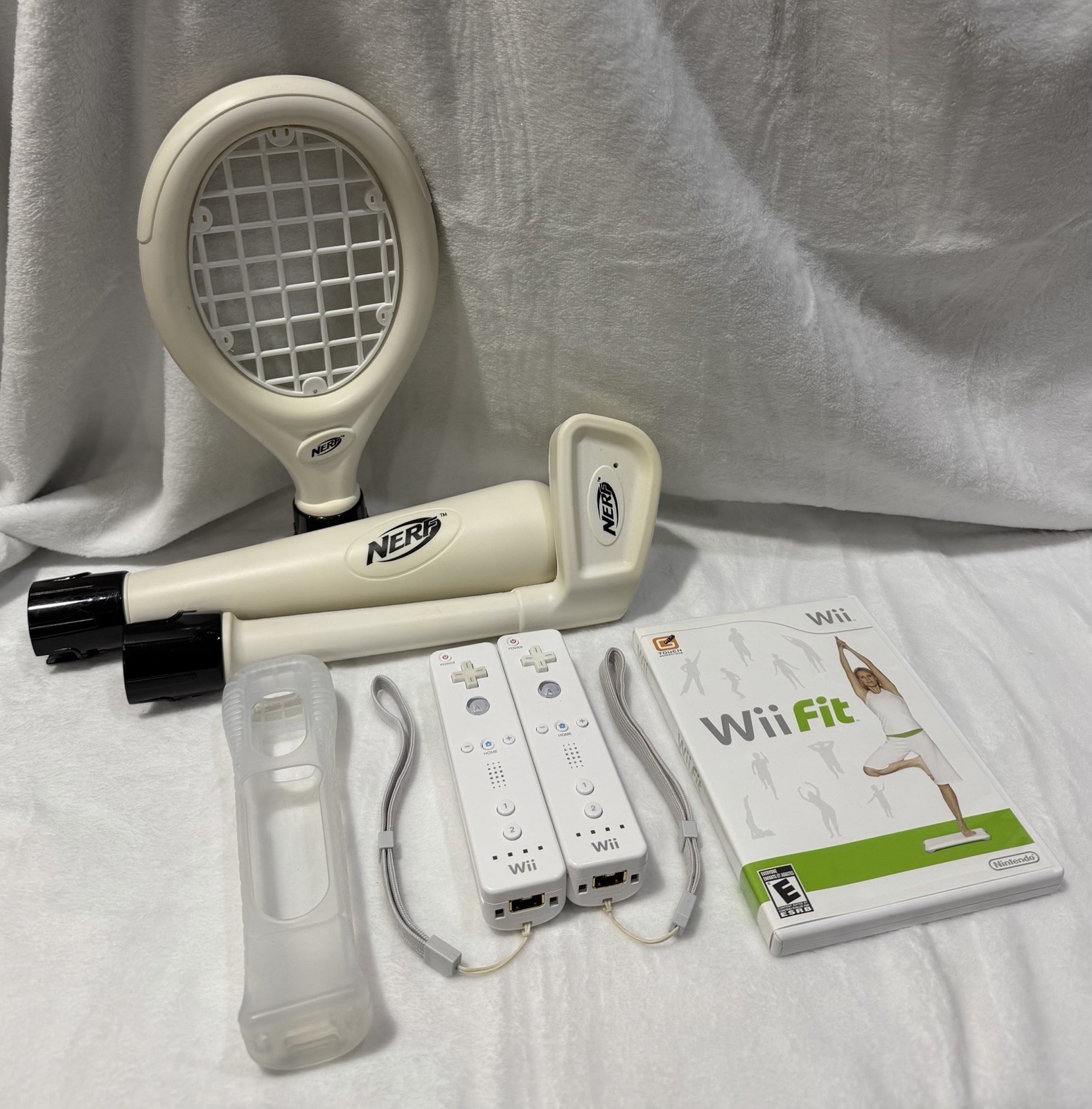 Nintendo Wii console with 2 remotes, 1 silicone sleeve & Nerf sports attachments
