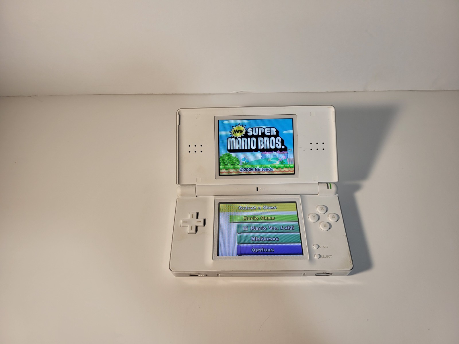 Nintendo DS Lite Handheld with Charger and Mario Bros USG-001 FULLY WORKING