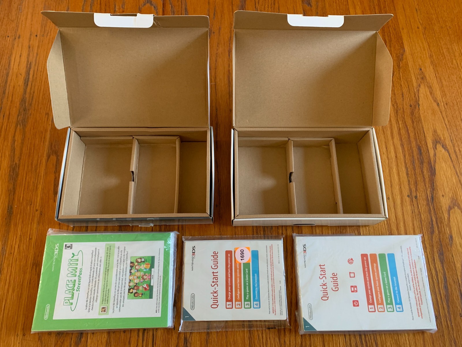 Lot of 2 Nintendo 3DS Cosmo Black and Flame Red console boxes and manuals only