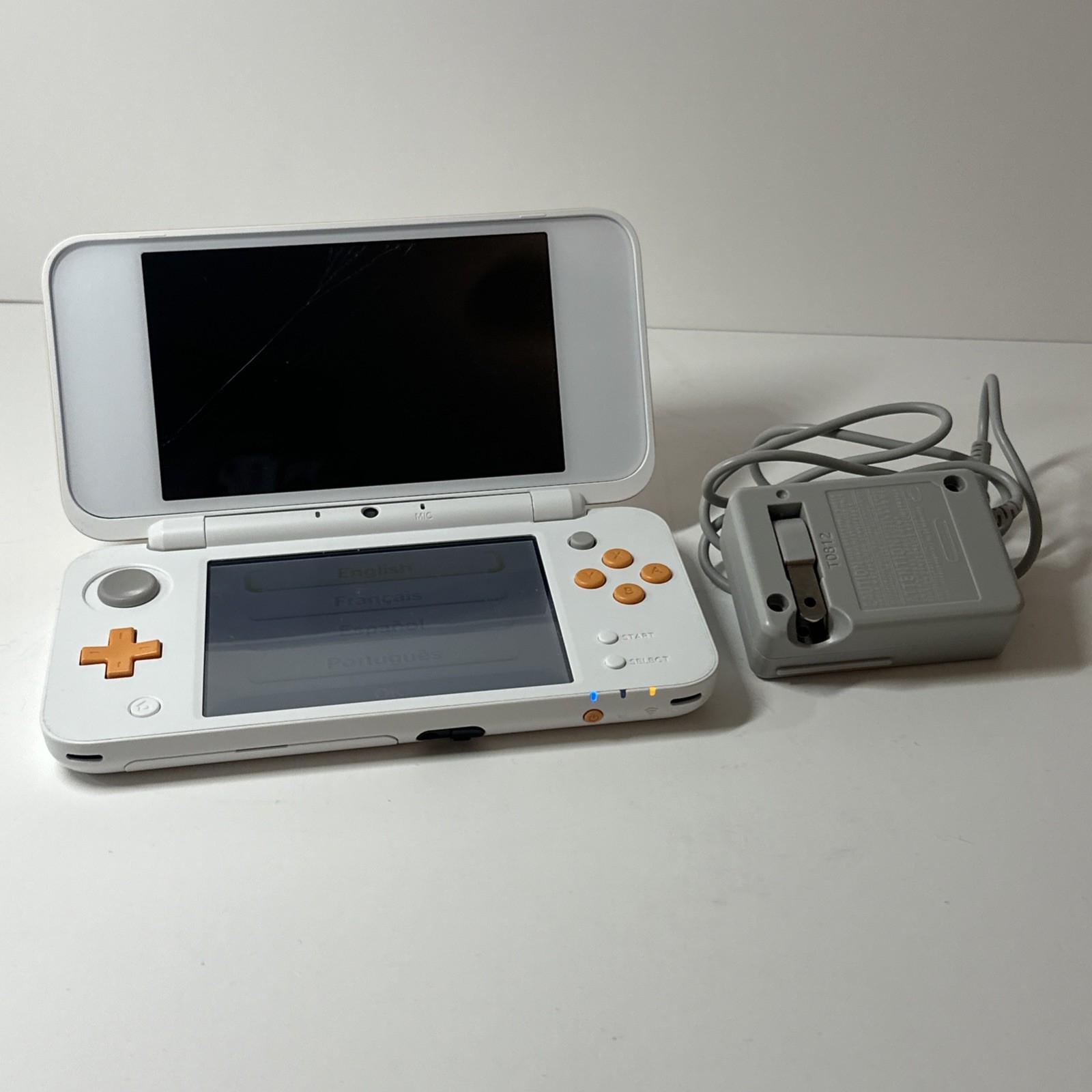 Nintendo 2DS XL – Orange & White Bundle (Top Screen Crack/ Non-OEM Charger)