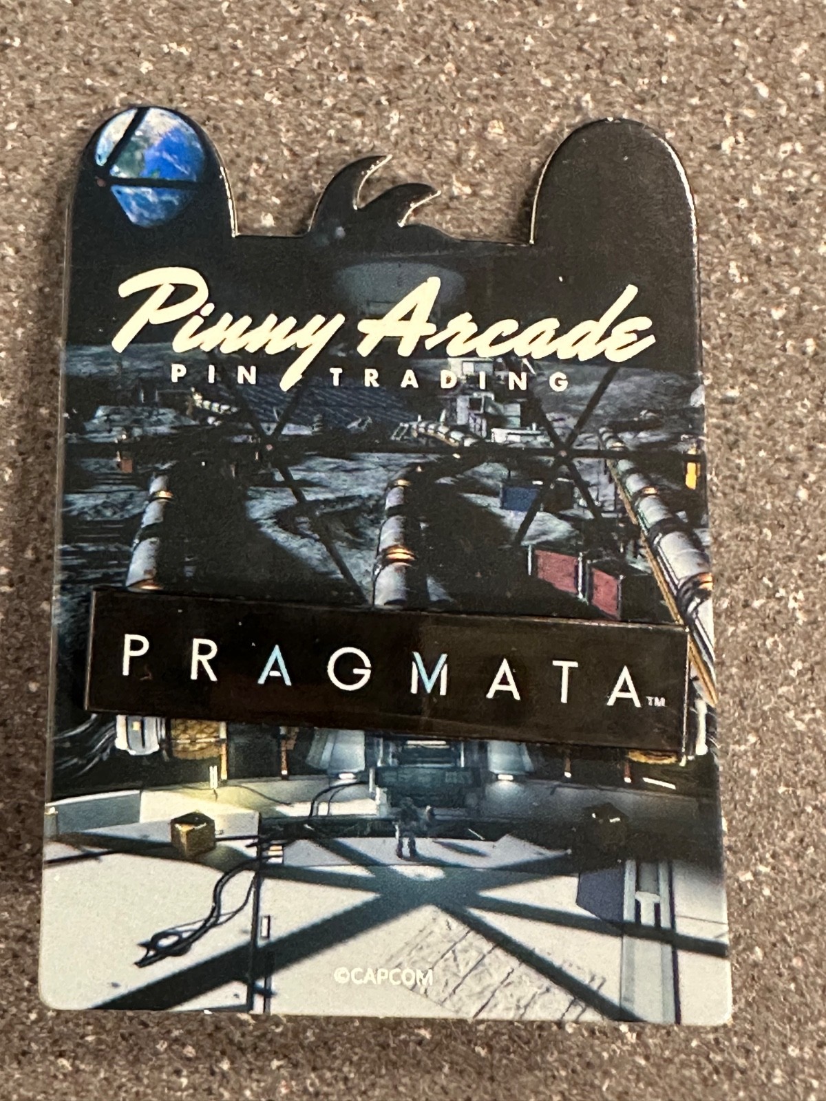 Capcom Pragmata Pinny Penny Arcade pin PAX West 2025 exclusive logo