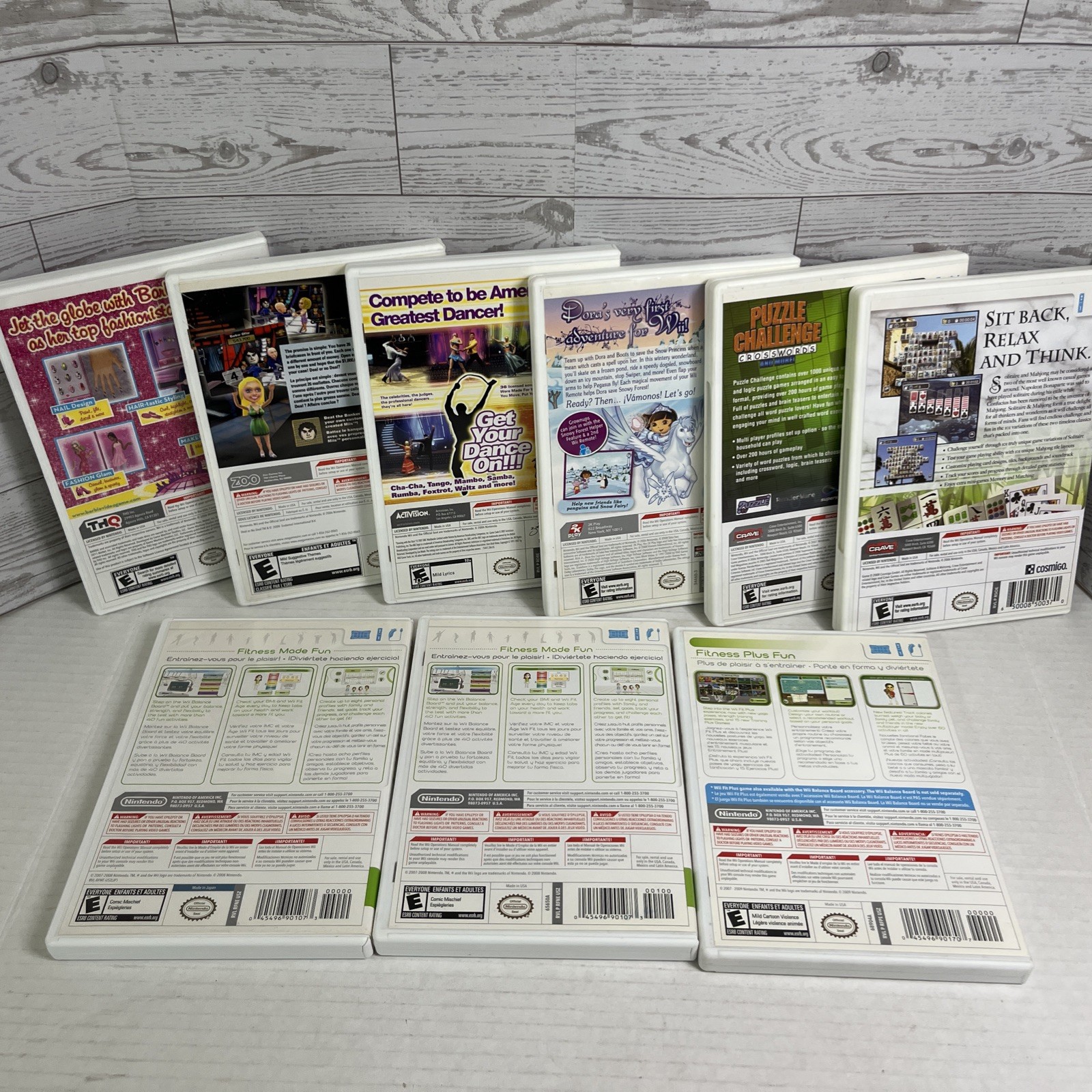 Lot of 8 Nintendo Wii Games Barbie Dora Wii Fit Plus Puzzle Deal or No Deal.