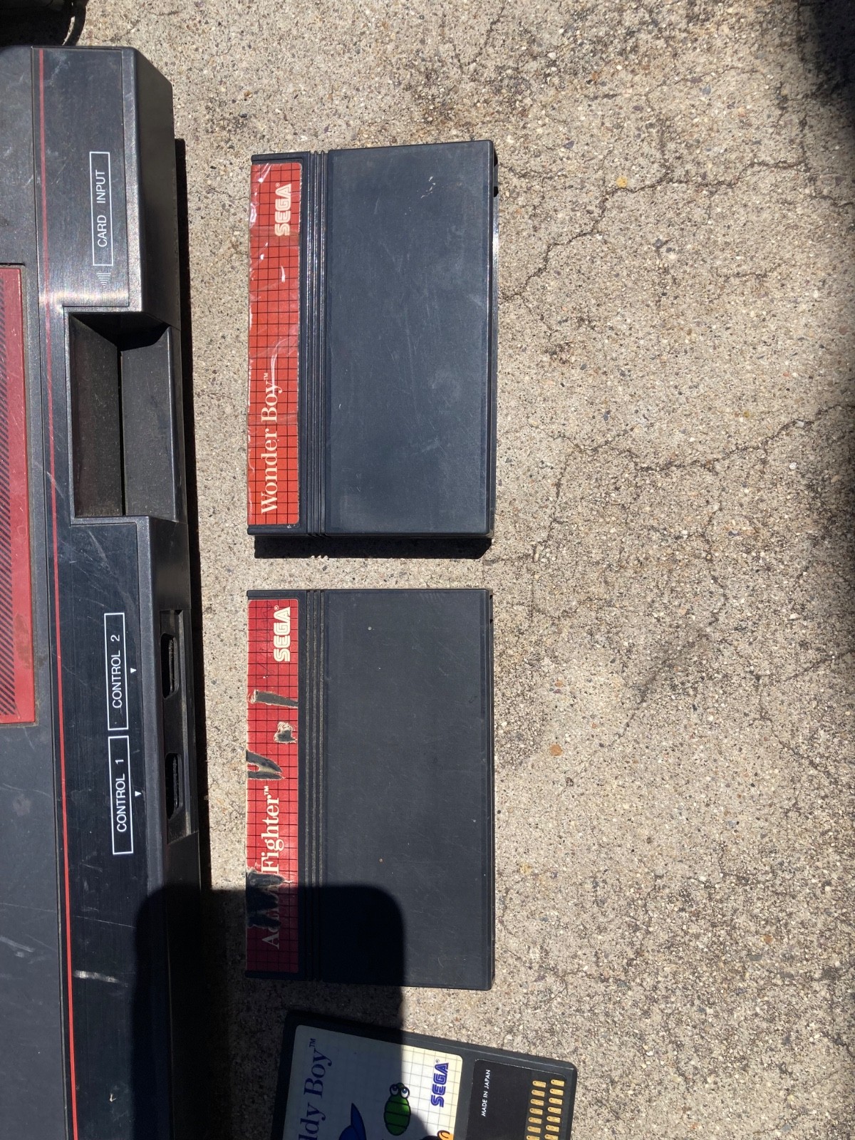 2 sega master system consoles with 3 controllers and games (not sure if it works