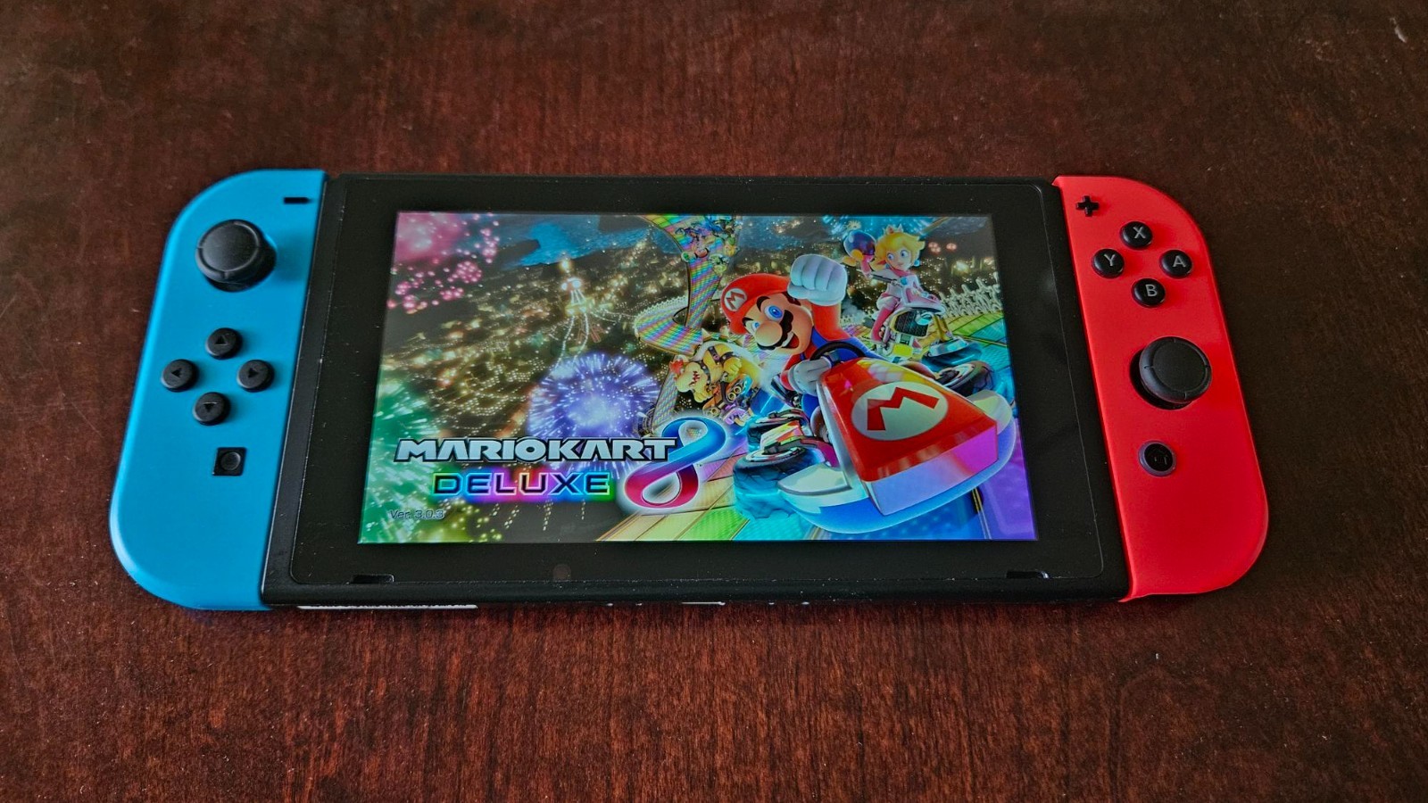Nintendo Switch with Blue and Red Joy-Con Controllers and Mariokart 8 & More