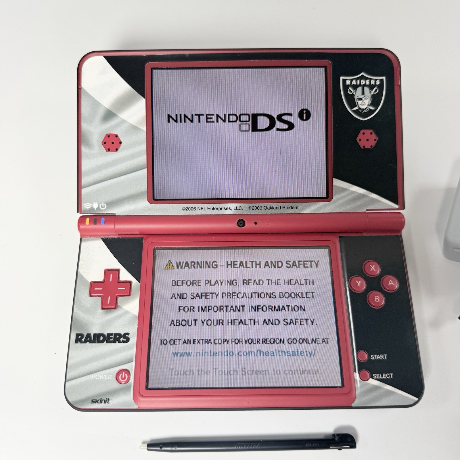 Nintendo DSi XL Red Console w/ Raiders Skin- Stylus + Charger USA Tested