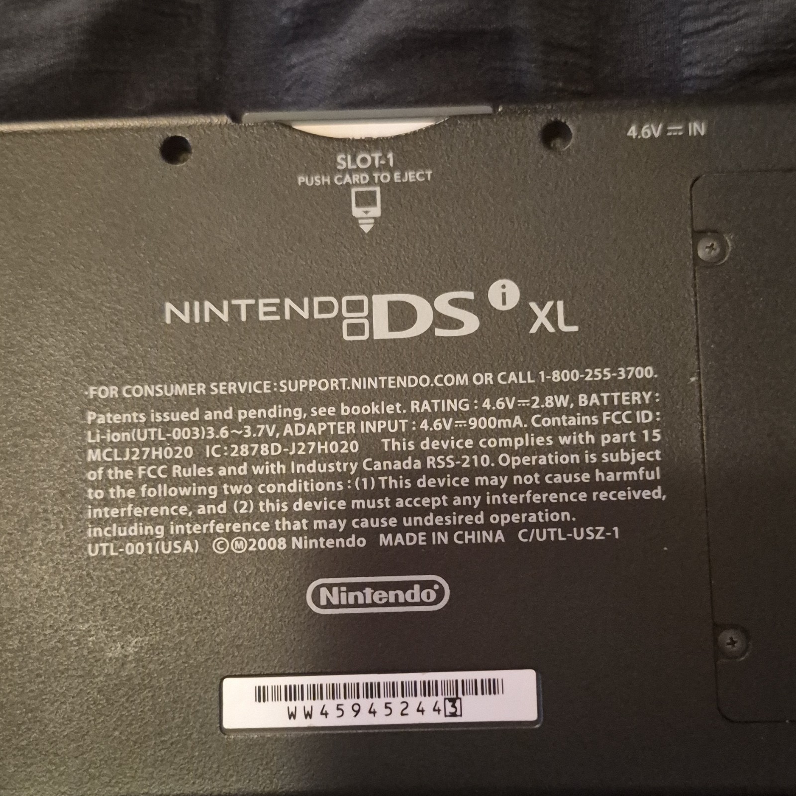 blue Nintendo DSi XL handheld console featuring a glossy Midnight Blue finish.