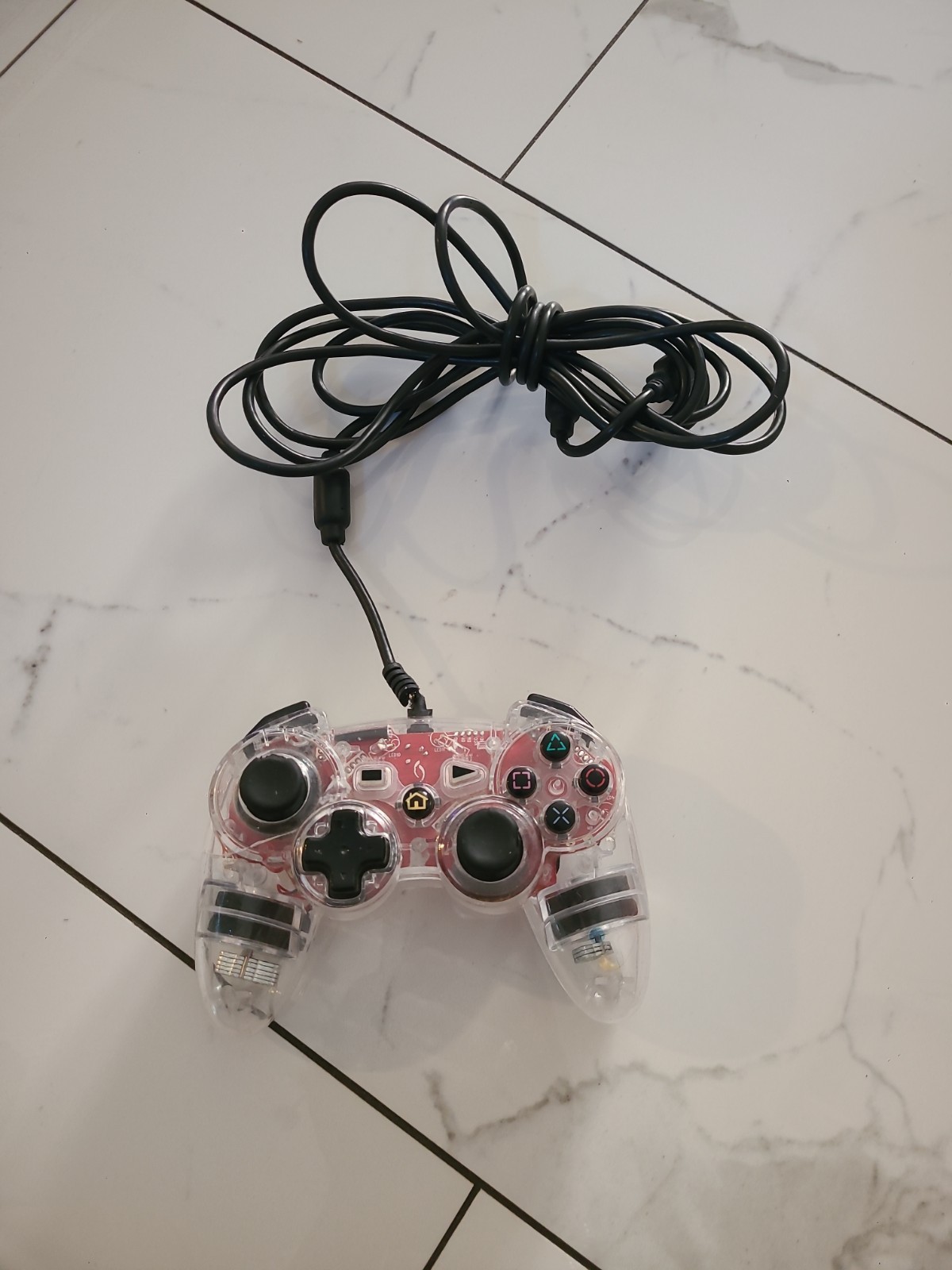 Third-party wired gaming controller for PlayStation 3, transparent pink…