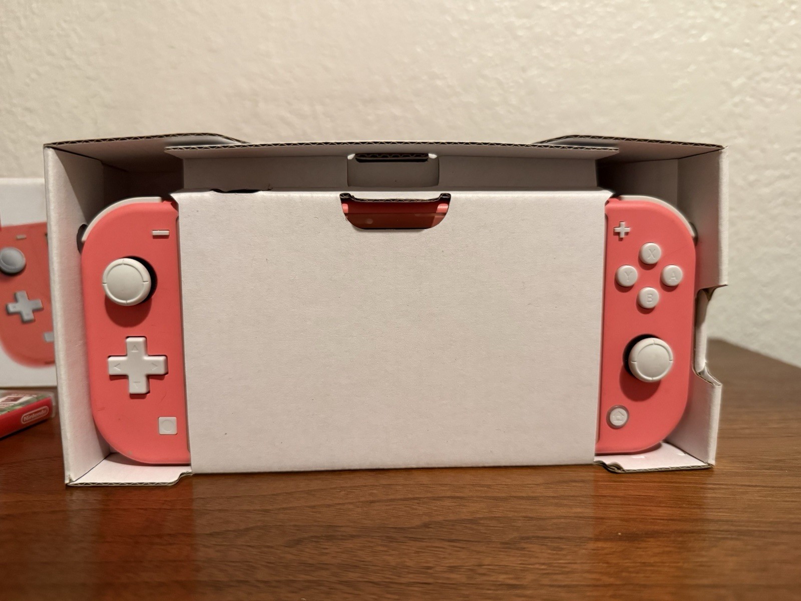 Nintendo Switch Lite 32 GB Gaming Console – Coral + Animal Crossing New Horizons