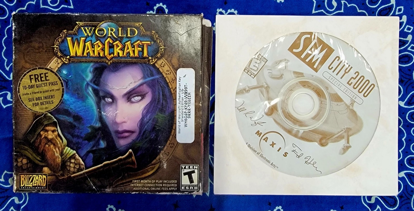 ​World of Warcraft PC 2004 Original 4-Disc Set & SimCity 2000 Special Edition CD