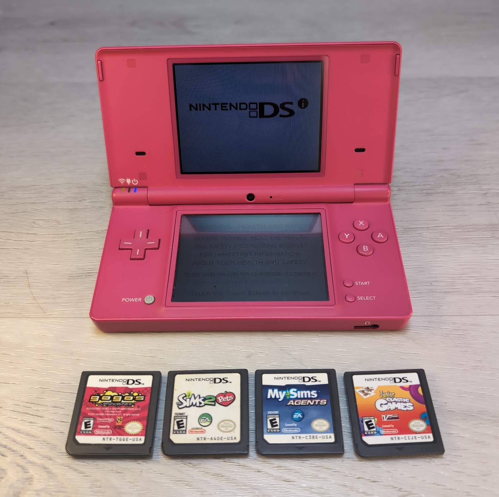 Nintendo DSi Pink Handheld Console Wi-Fi Nintendo DS TWL-001 & (4) Games Sims