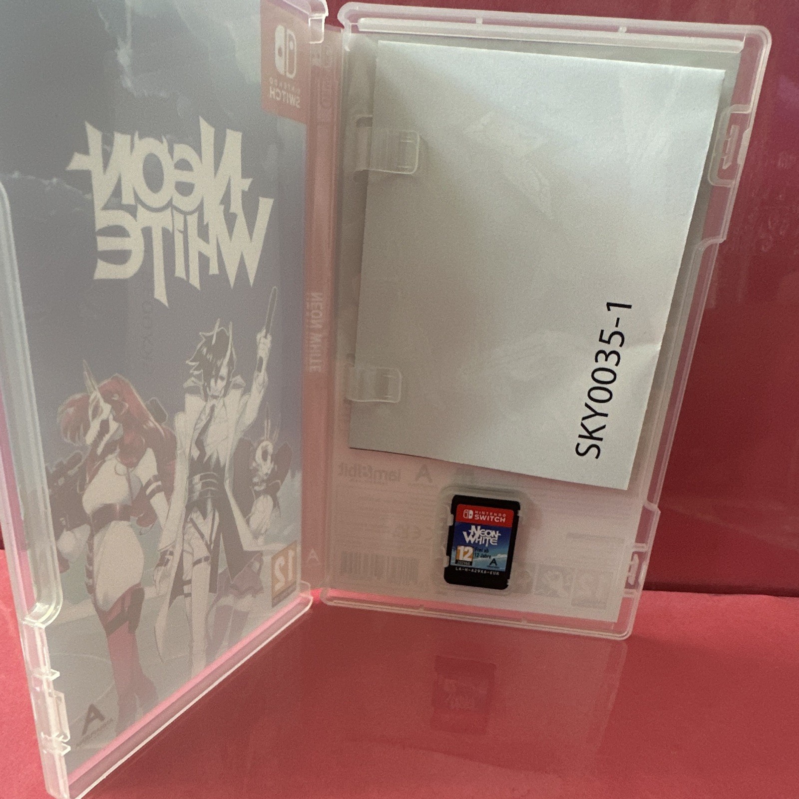 Neon White Nintendo Switch 2022 PEGI 12 PAL Manual Case and poster