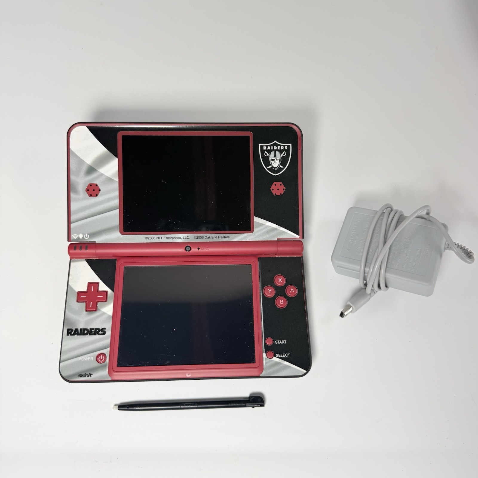Nintendo DSi XL Red Console w/ Raiders Skin- Stylus + Charger USA Tested