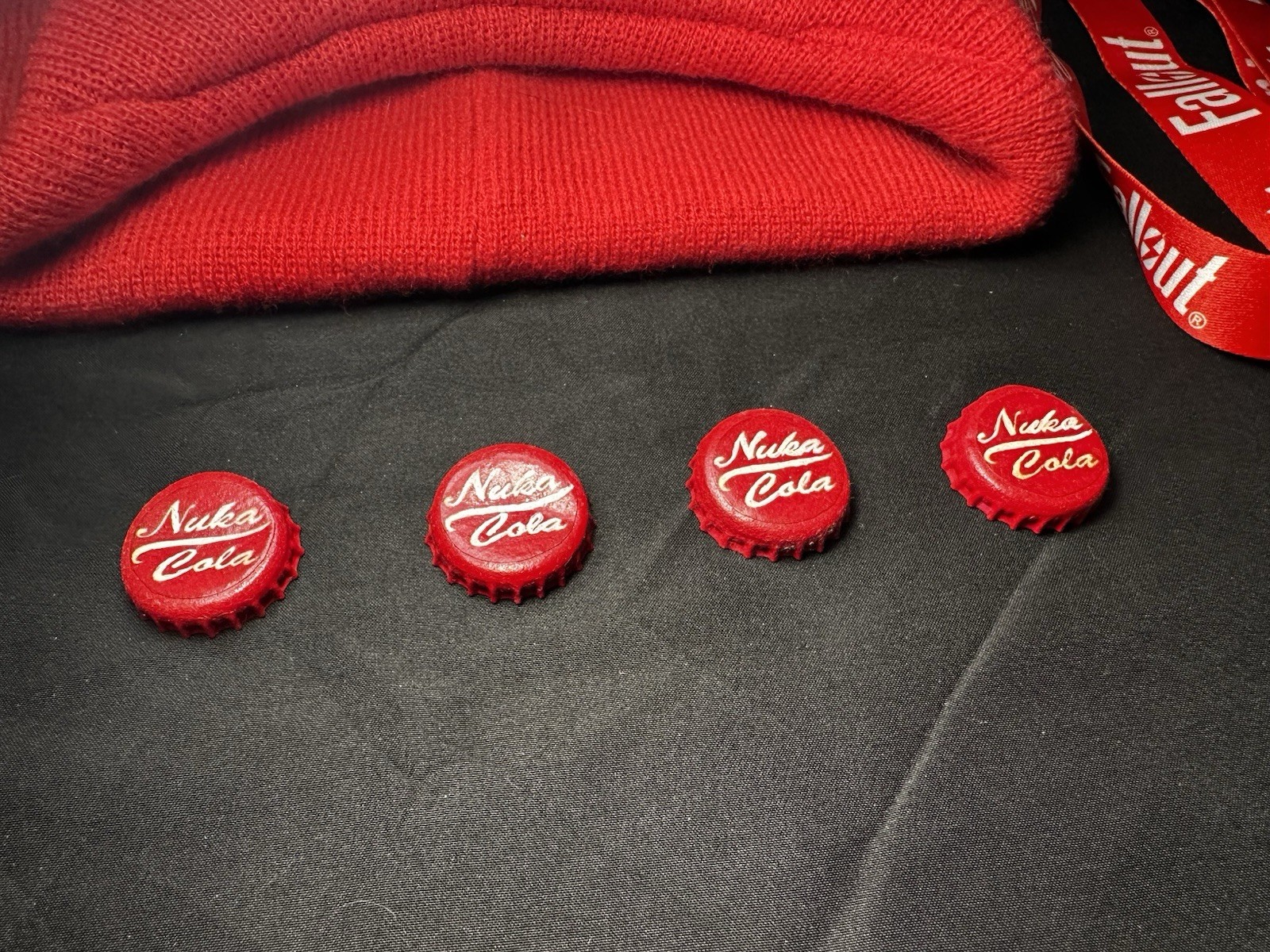 Lot of Bethesda Fallout Nuka Cola Bottle Caps, Beanie Hat, Lanyard & Keychain
