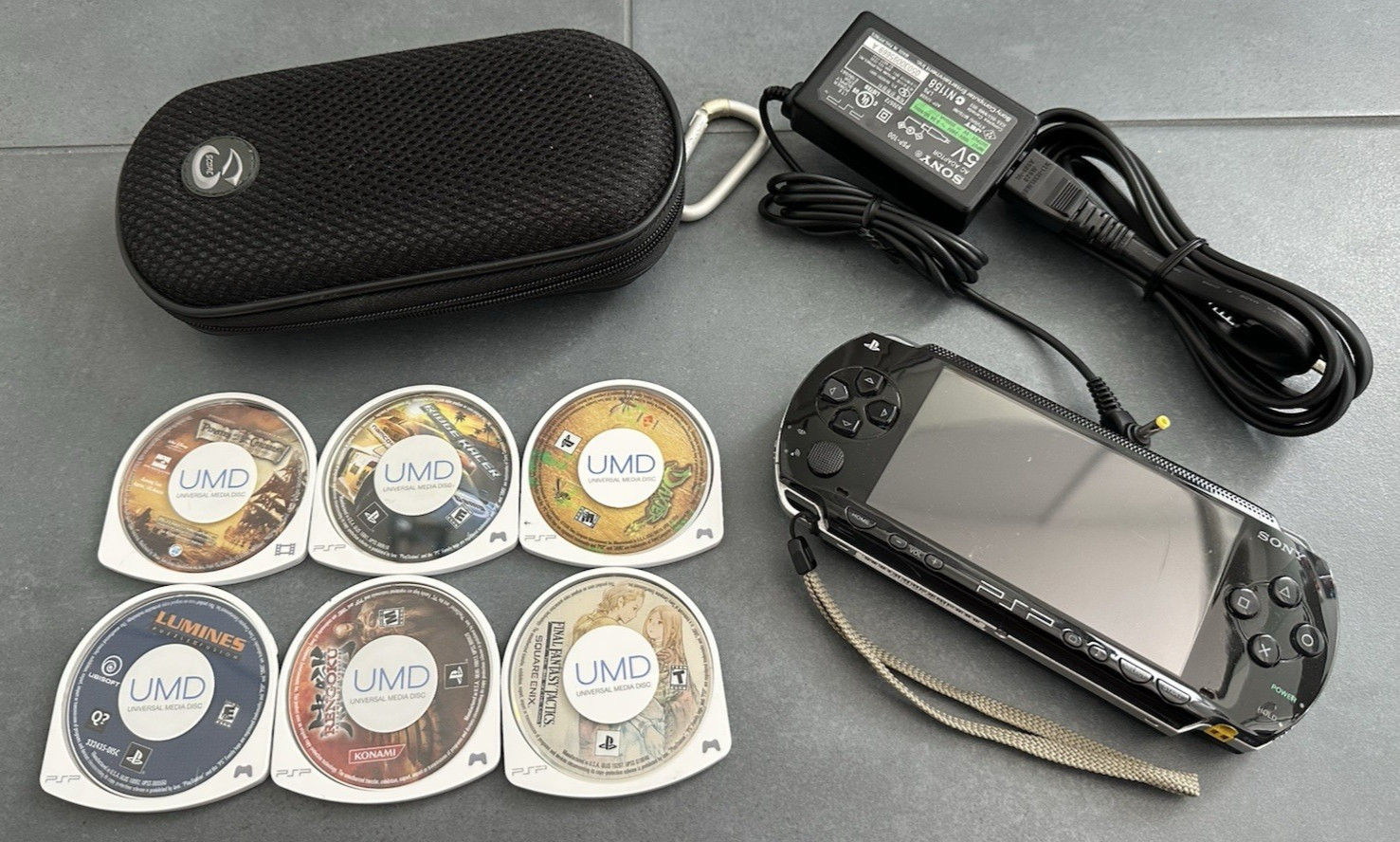 Sony PlayStation PSP-1001 Black PSP Portable Console + 6 Games + Charger + Case