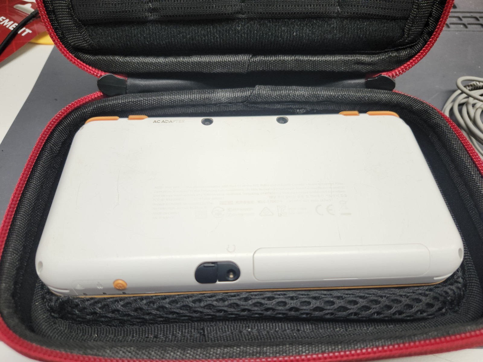 Nintendo 2DS XL Console w/ 6 games. Zelda, Starfox, LOTR & more. White & Orange