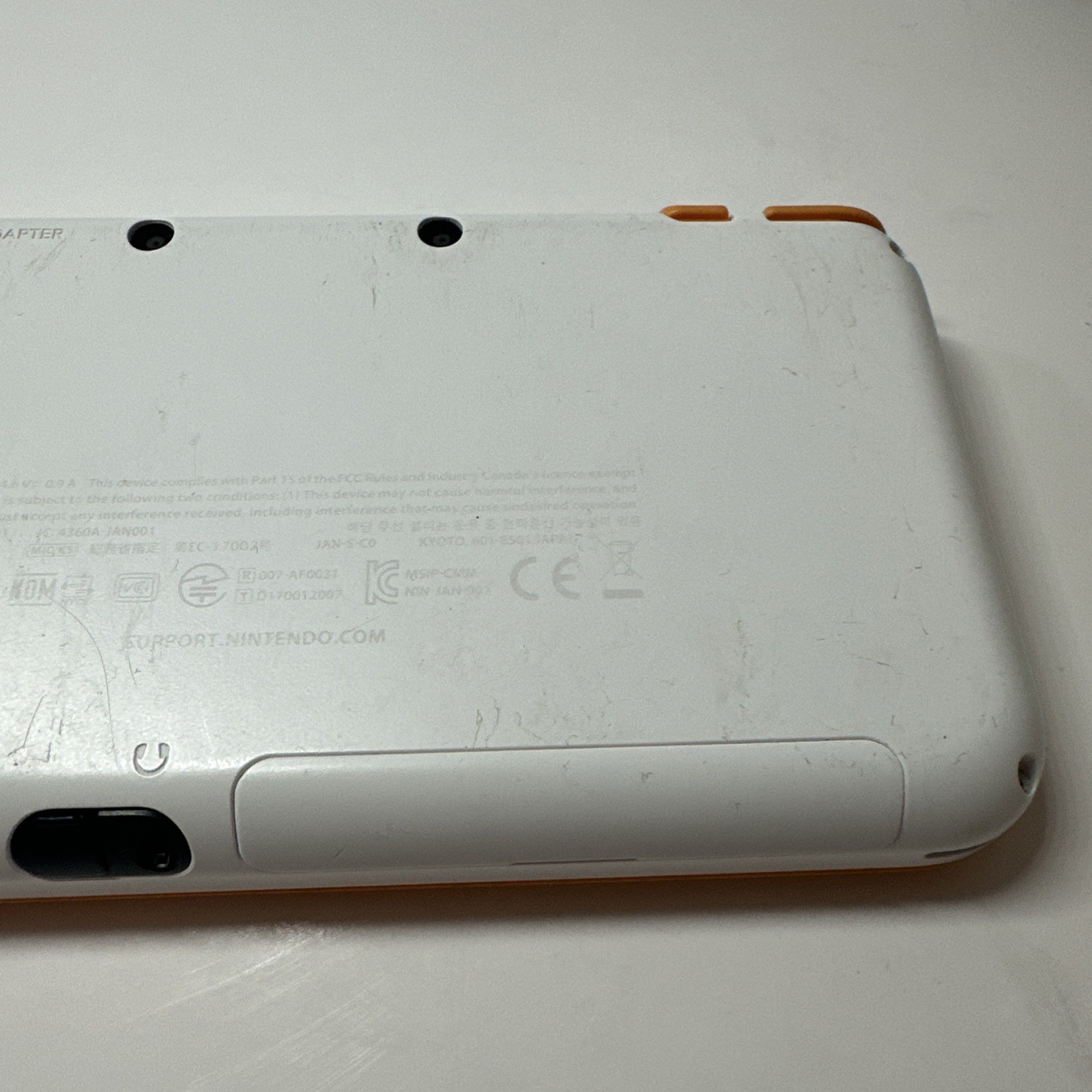Nintendo 2DS XL – Orange & White Bundle (Top Screen Crack/ Non-OEM Charger)