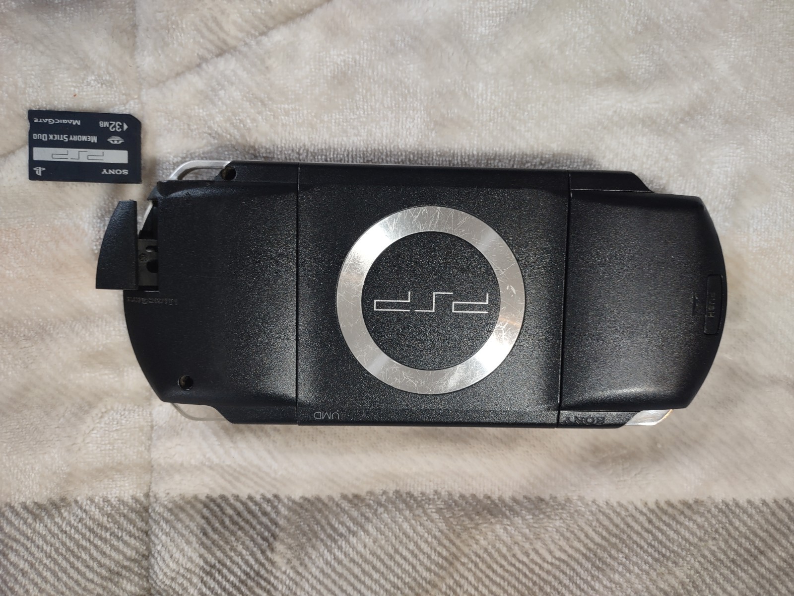 Sony PlayStation PSP-1001 w/Clear Travel Case, Charger, Memory, 8 games 1 movie