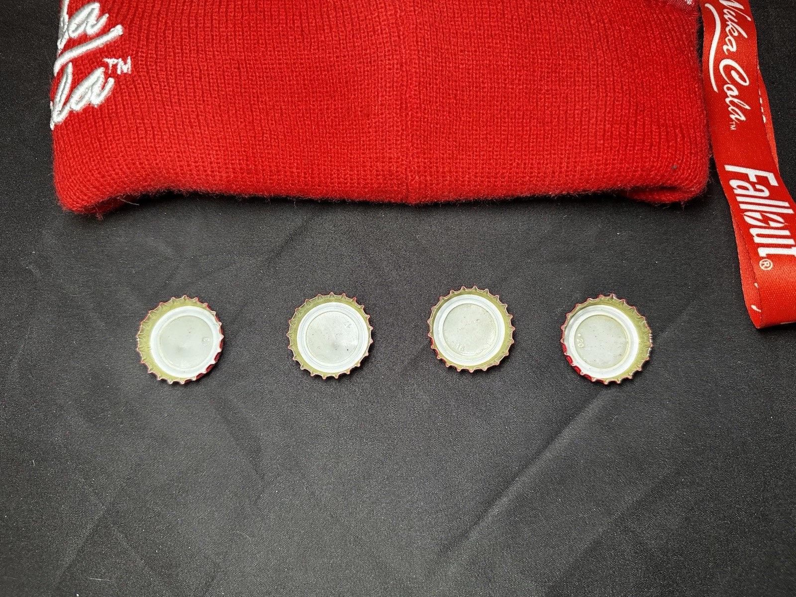 Lot of Bethesda Fallout Nuka Cola Bottle Caps, Beanie Hat, Lanyard & Keychain
