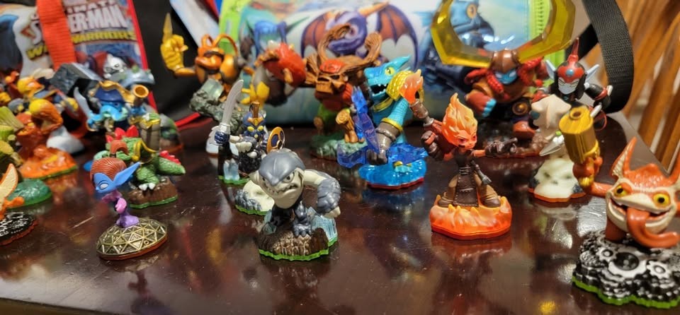 Skylanders collection of figures, 3DS games, items, vehicles, and carrying bags