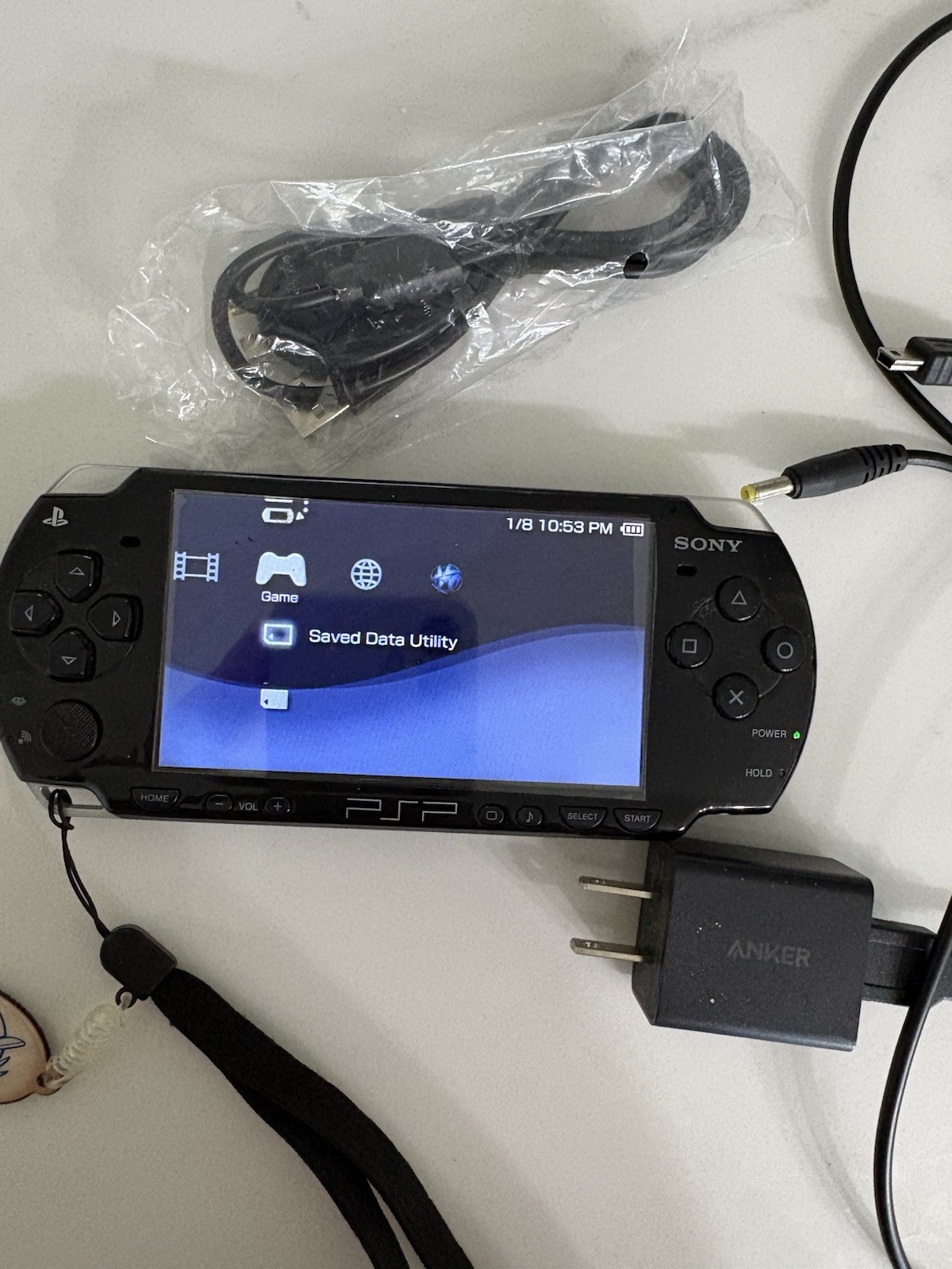 Sony PSP Black works great! w/ Wall Charger, USB Cable & Wrist Strap