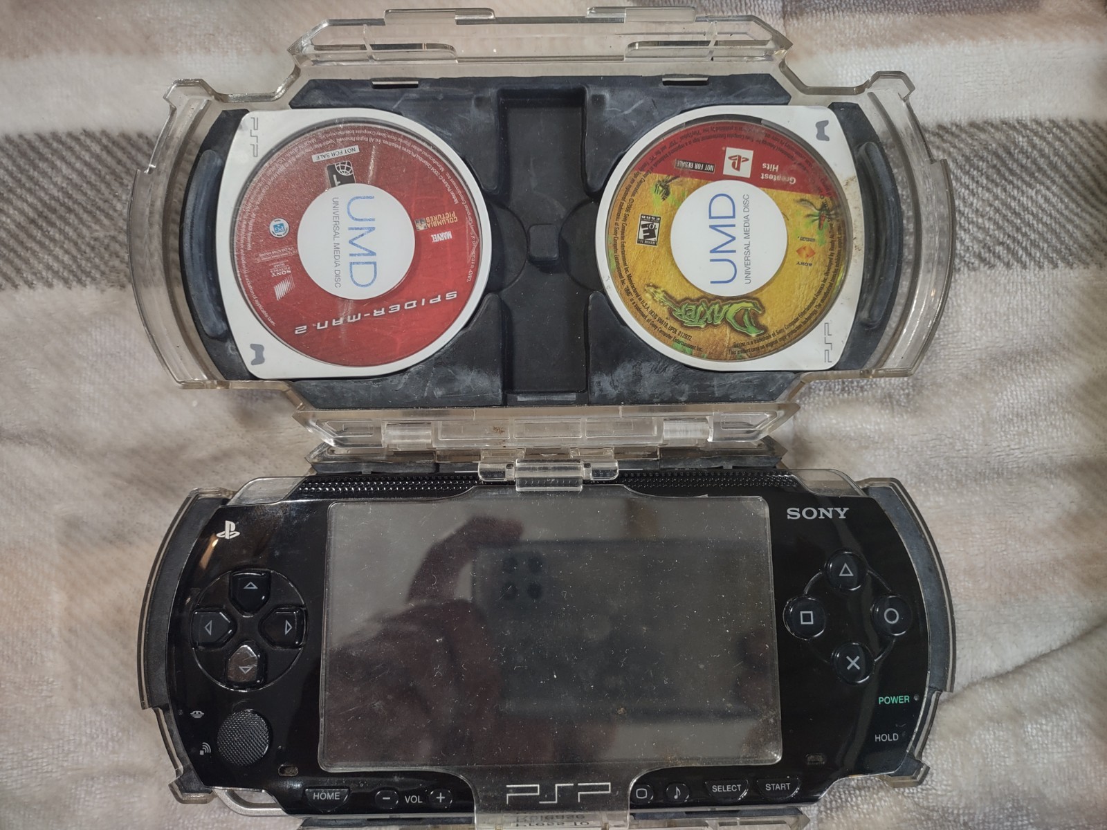Sony PlayStation PSP-1001 w/Clear Travel Case, Charger, Memory, 8 games 1 movie