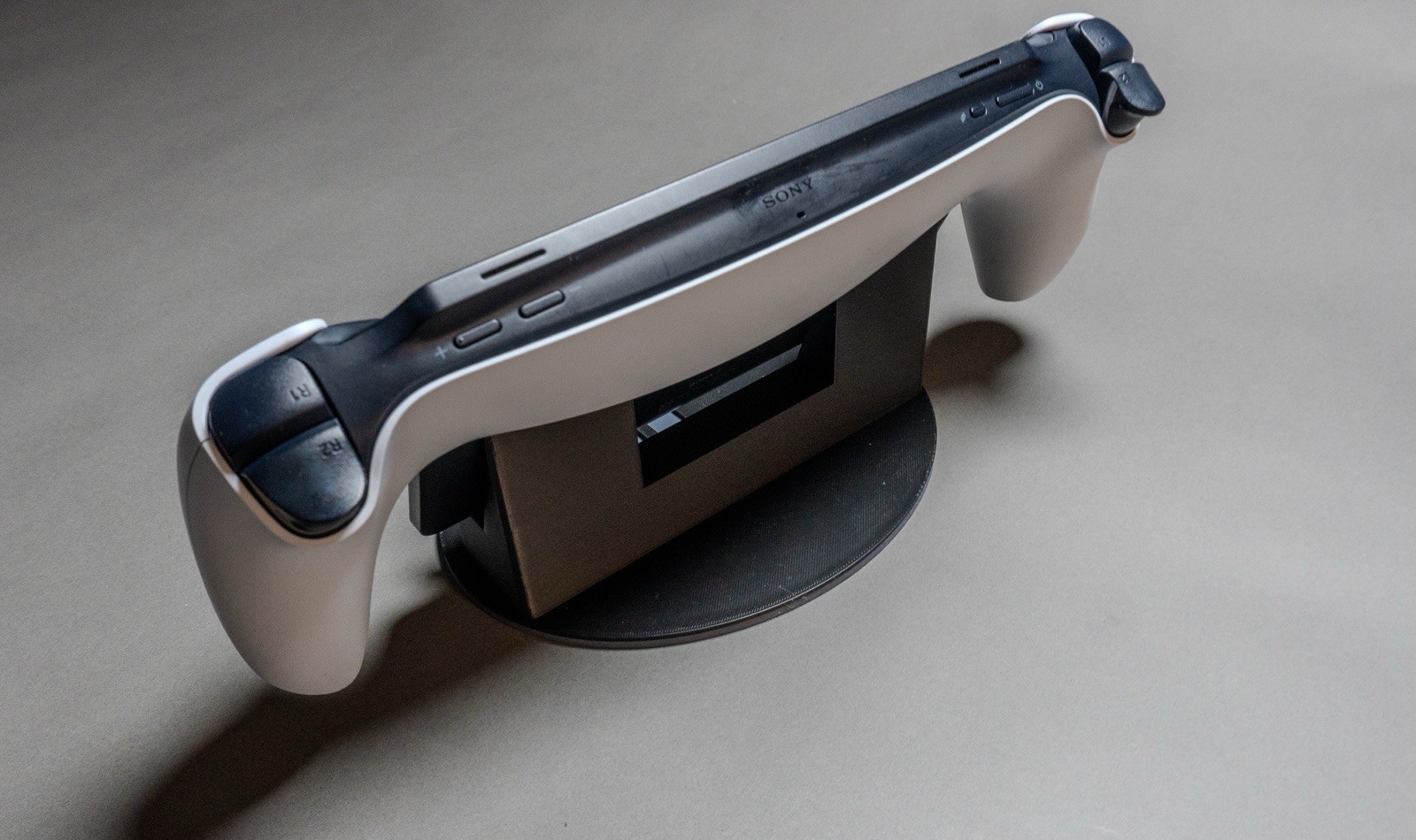 Sony PlayStation Portal Display Stand with Classic PS Logo Black and Gray.