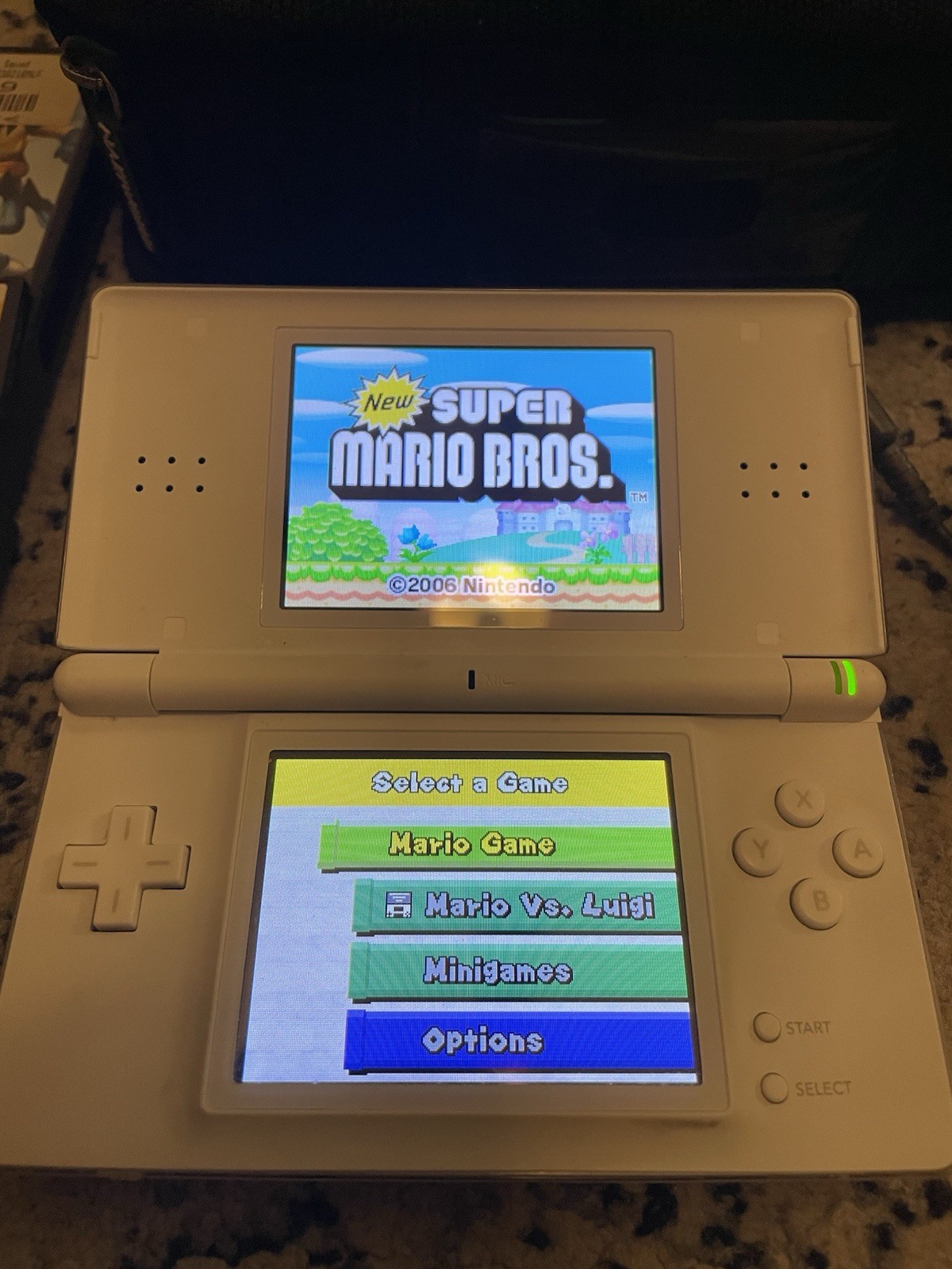 Nintendo DS Lite White Console Bundle 4 Games Mario Marvel Case Charger