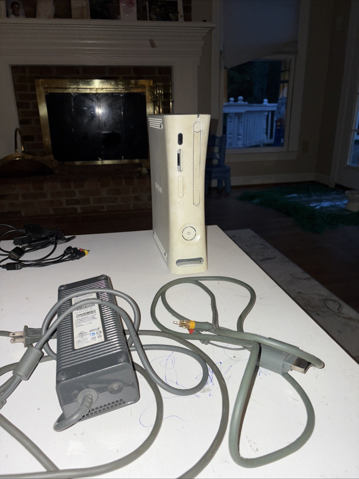 Xbox 360 With Cables Included. No Controller included Also, Not Sure If It Works