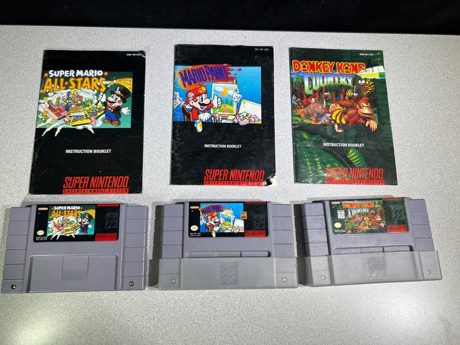 Super NES SNS-001 Console, Controllers, Paint Pad w/Mouse, Game Genie & 7 Games