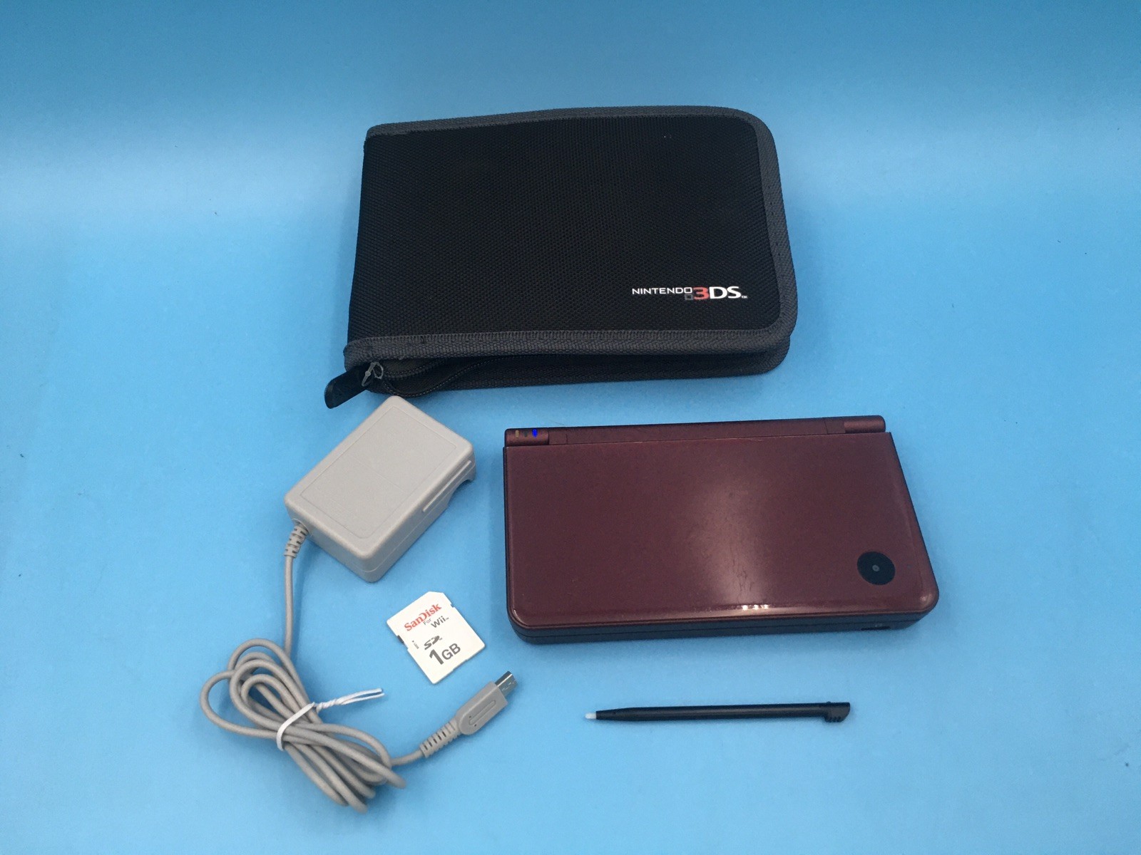 Nintendo DSi XL Red Burgundy UTL-001 w/ Stylus, Charger, 1gb SD Card, & Case