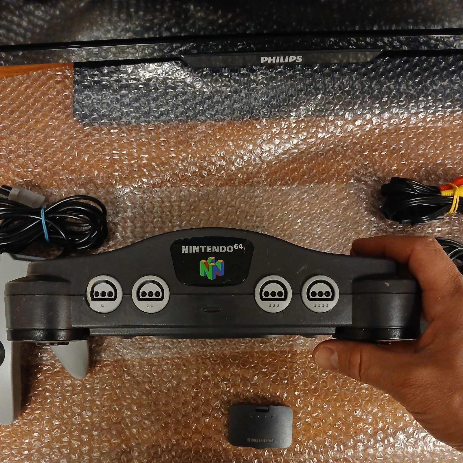 Nintendo 64 with expansion pak, power & AV cords, & one controller.