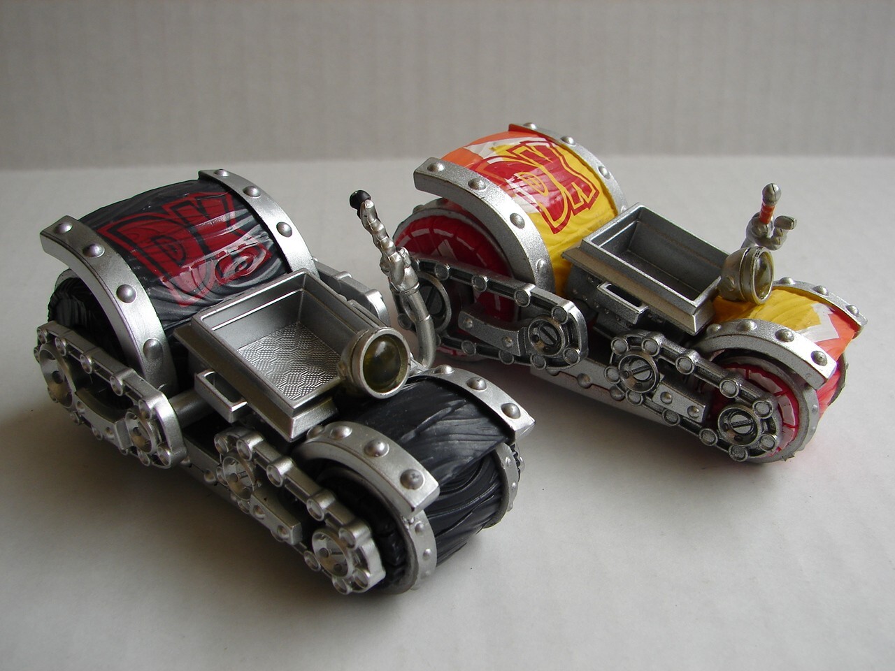two different Skylanders: SuperChargers: Dark Barrel Blaster and yellow