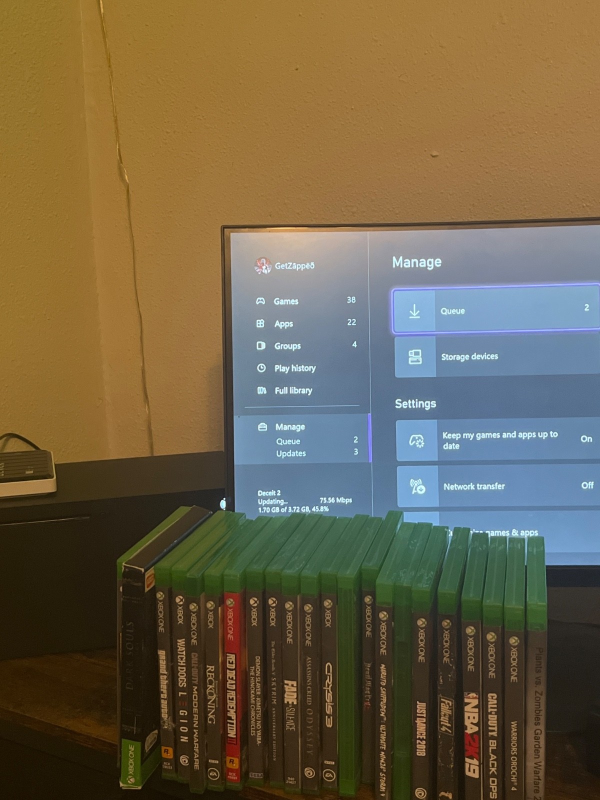 xbox series x console with monitor, games and external hard with two controller