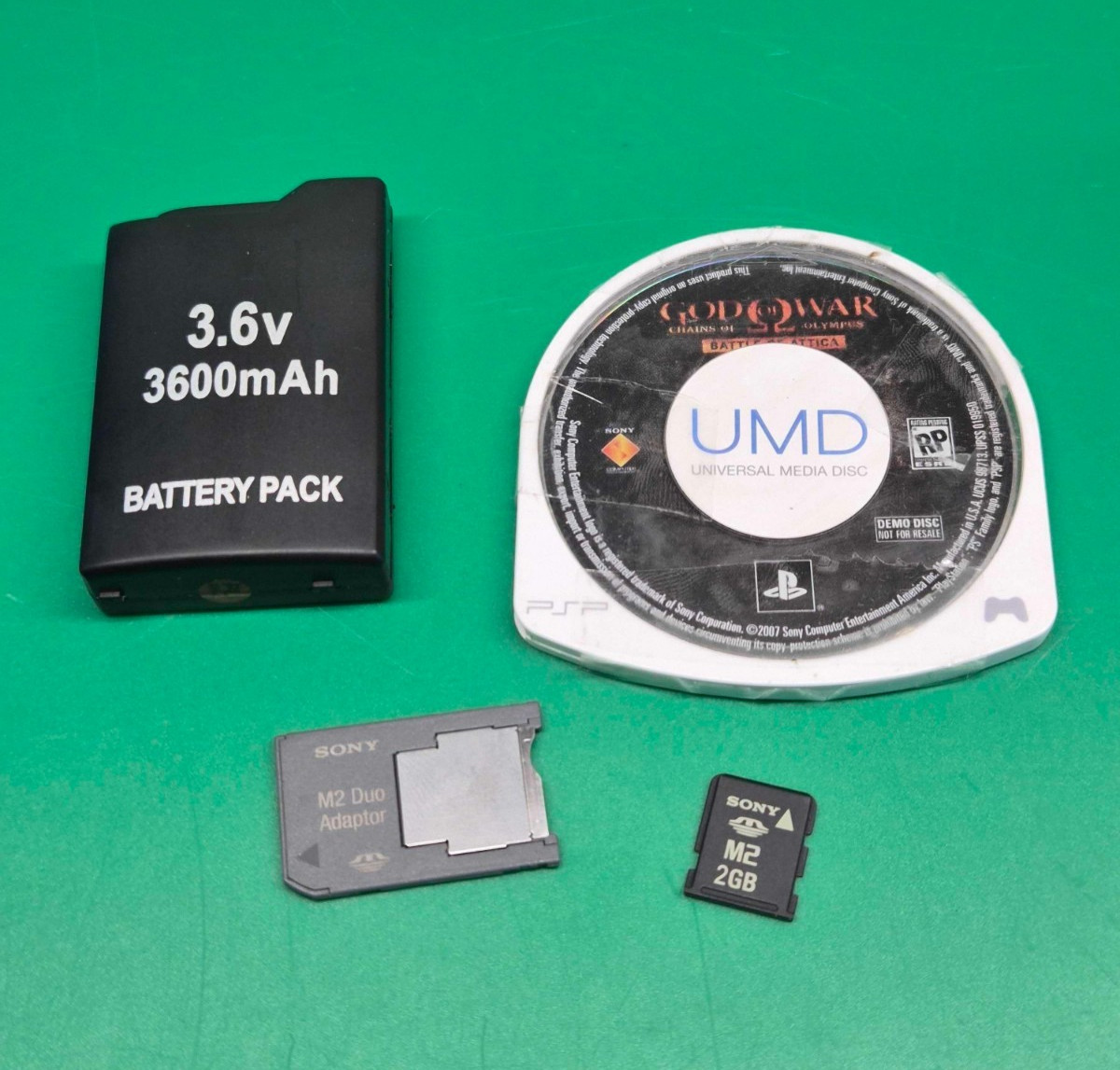 Sony PSP-1001 Handheld Console – New Battery, 2GB M2 Card, God of War Demo Disc