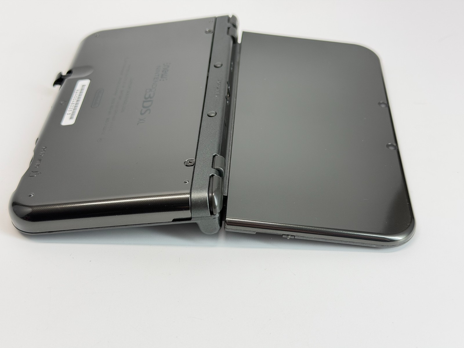 Nintendo New 3DS XL Metallic Black Handheld System *Screen has Yellow Line*