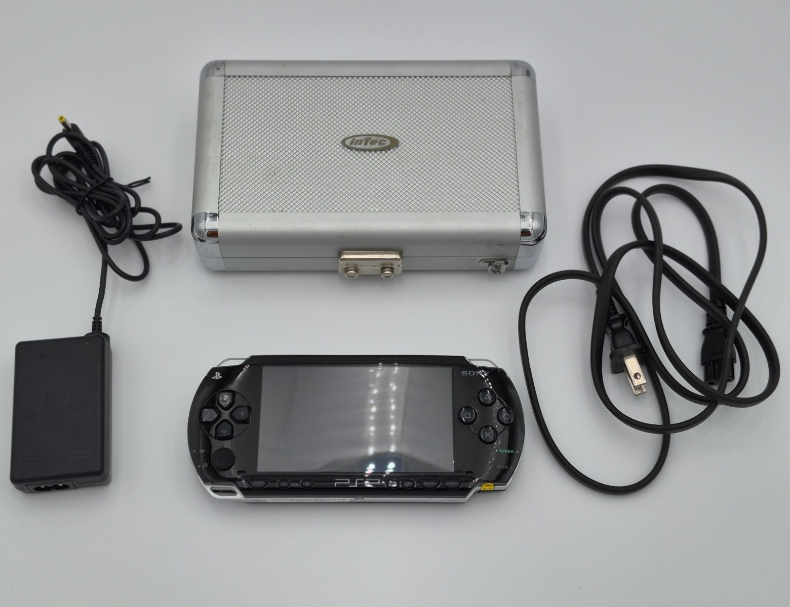 Sony PSP-1001 Black Handheld Console Bundle w/ Adapter, USB, Case UMD NTSC