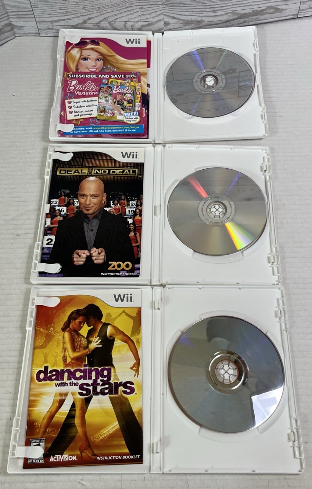Lot of 8 Nintendo Wii Games Barbie Dora Wii Fit Plus Puzzle Deal or No Deal.