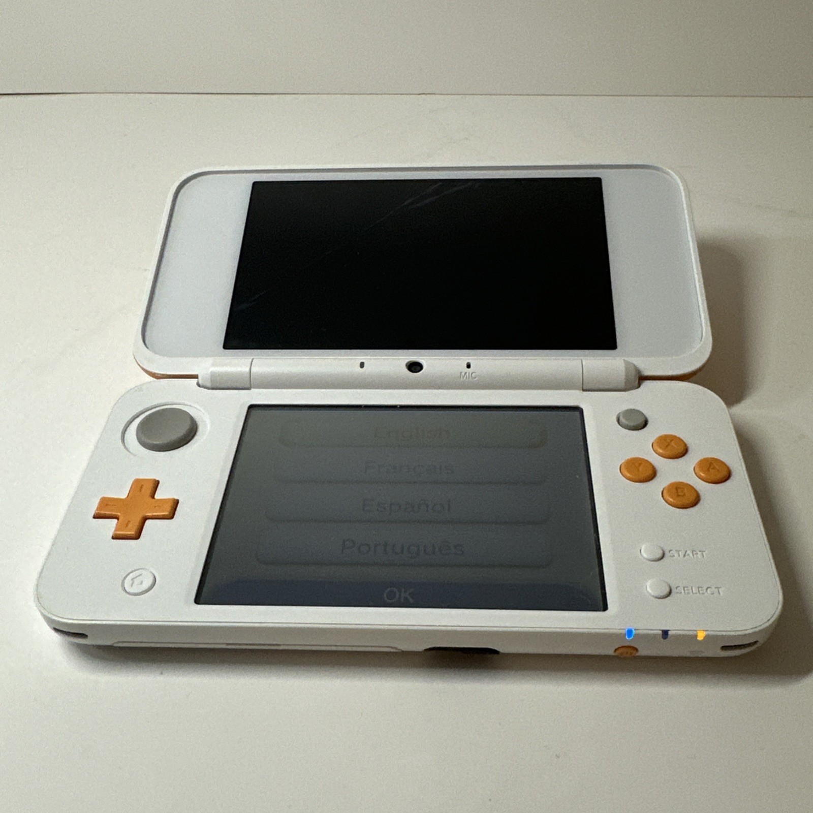 Nintendo 2DS XL – Orange & White Bundle (Top Screen Crack/ Non-OEM Charger)