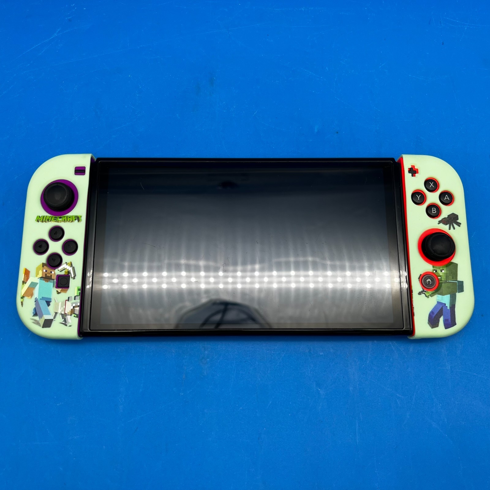 Nintendo Switch OLED Model HEG-001 Handheld Console – 64GB (Red/Purple Joy-Cons)
