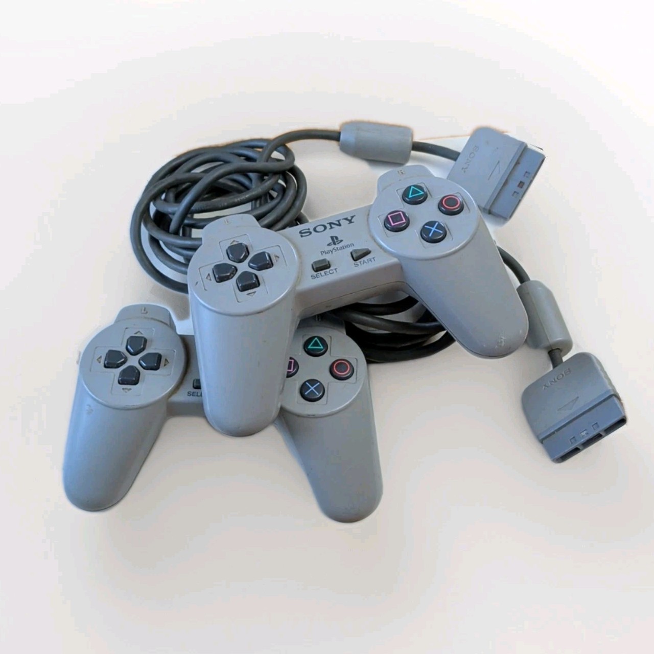 Sony PlayStation 1 Light Gray Controllers (x2) – Untested