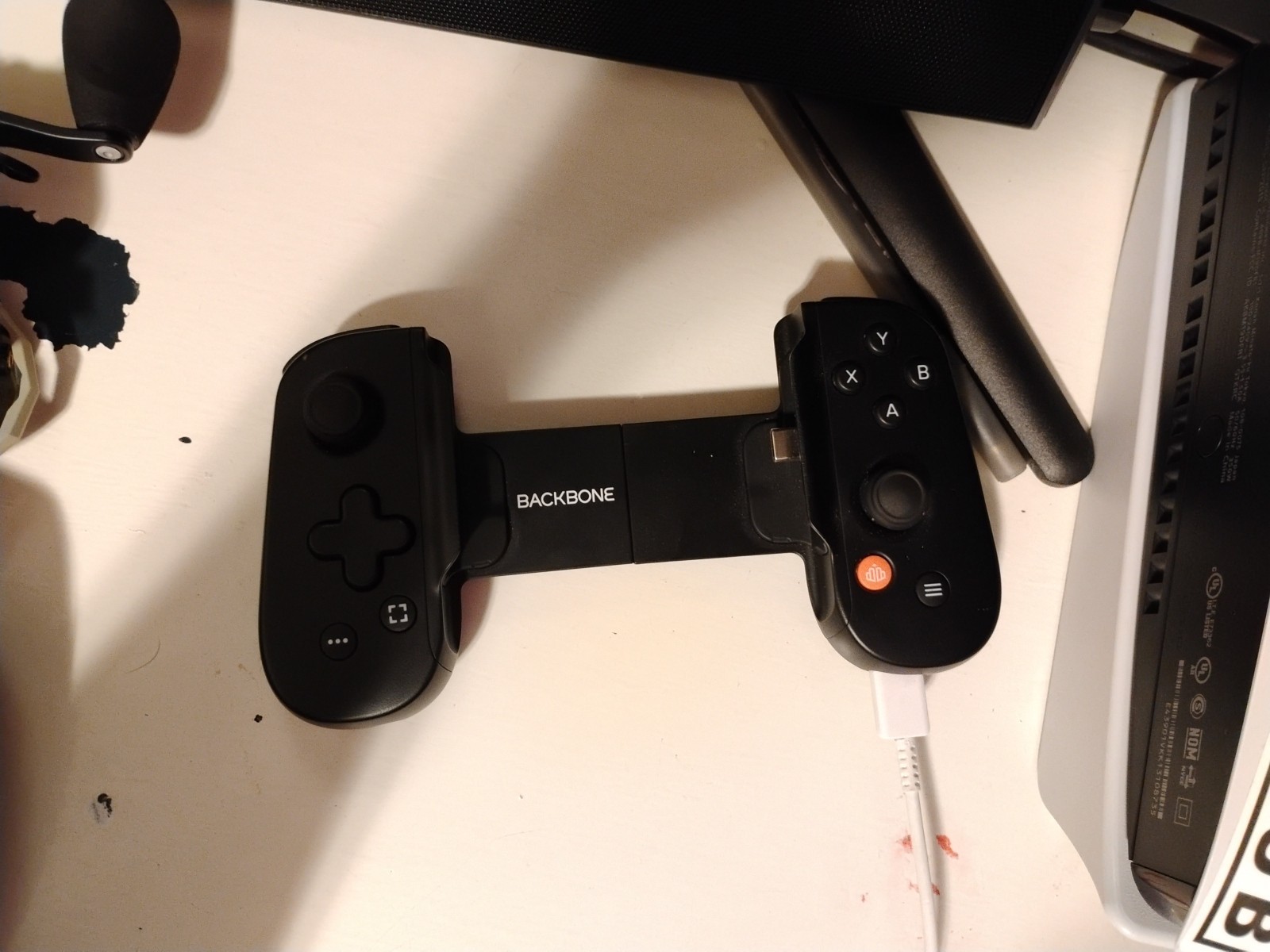 BackBone Thing, 3.5mm Headphone Jack, Can Fit some Iphone, Androids And Samsung