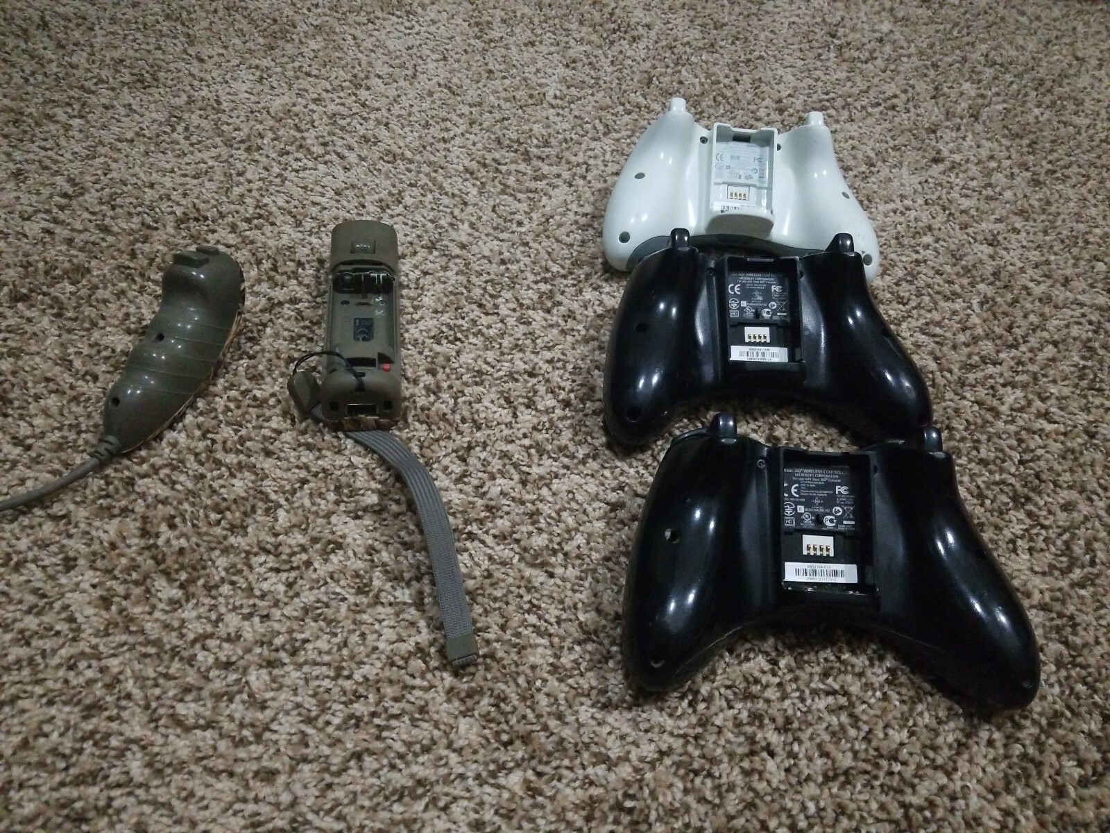 Xbox And Wii Remotes As Is Of For Parts not sure if they work or not no backs