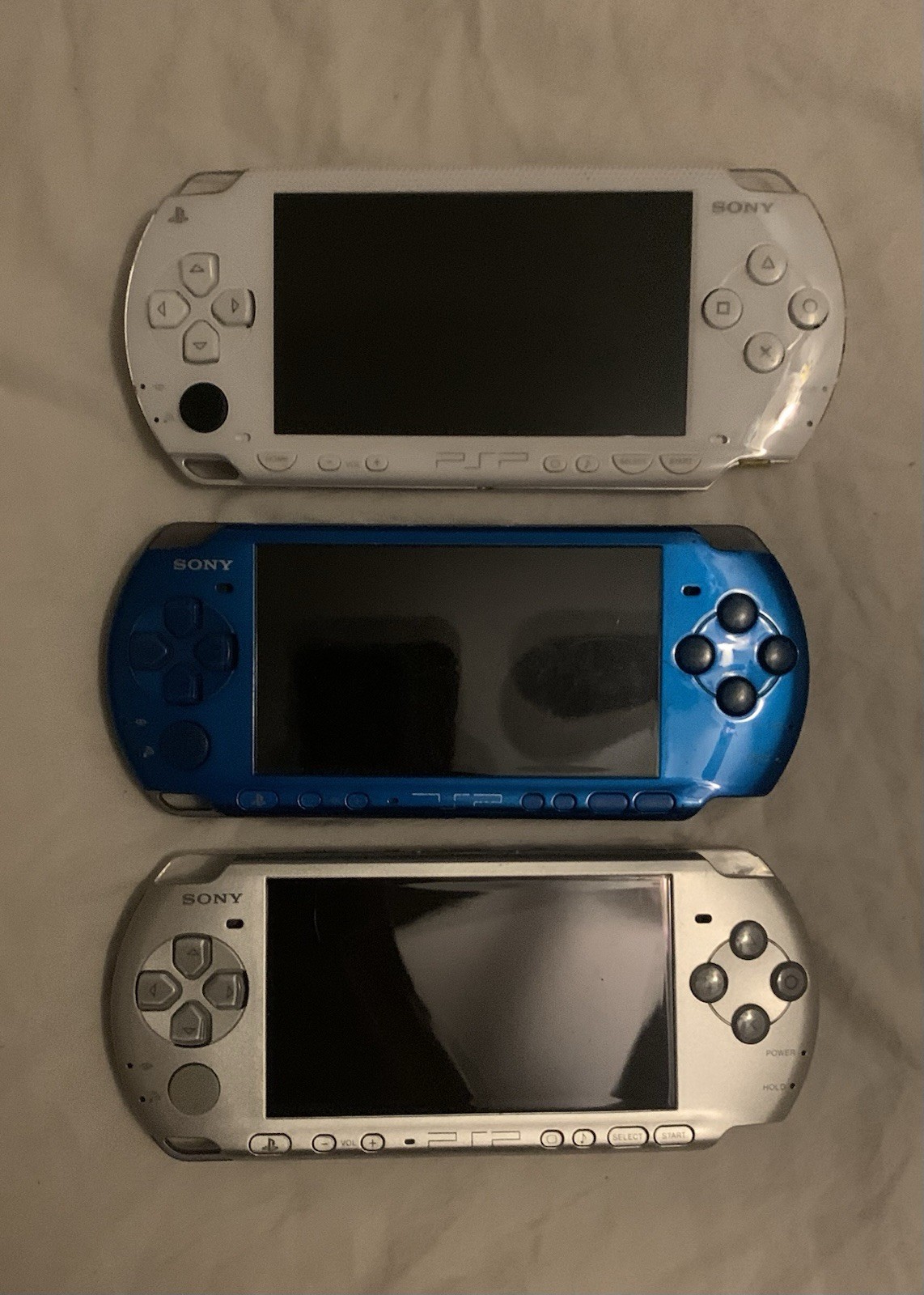 Sony PSP Handheld System Lot of 3 (White/Silver/Blue) and 2 PSP for parts/repair