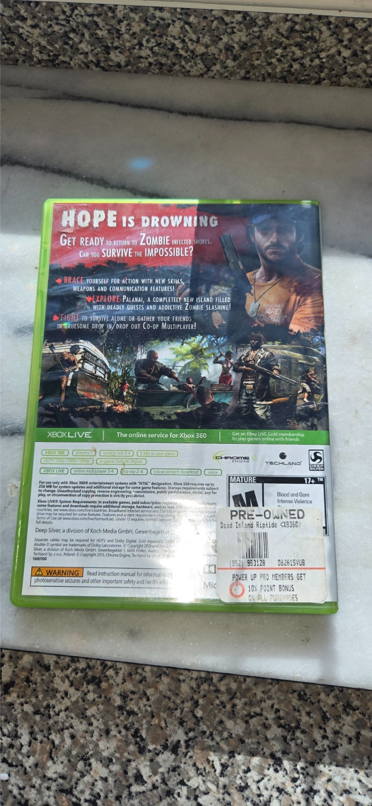 pre-owned copy of the video game Dead Island: Riptide for the Xbox 360 platform