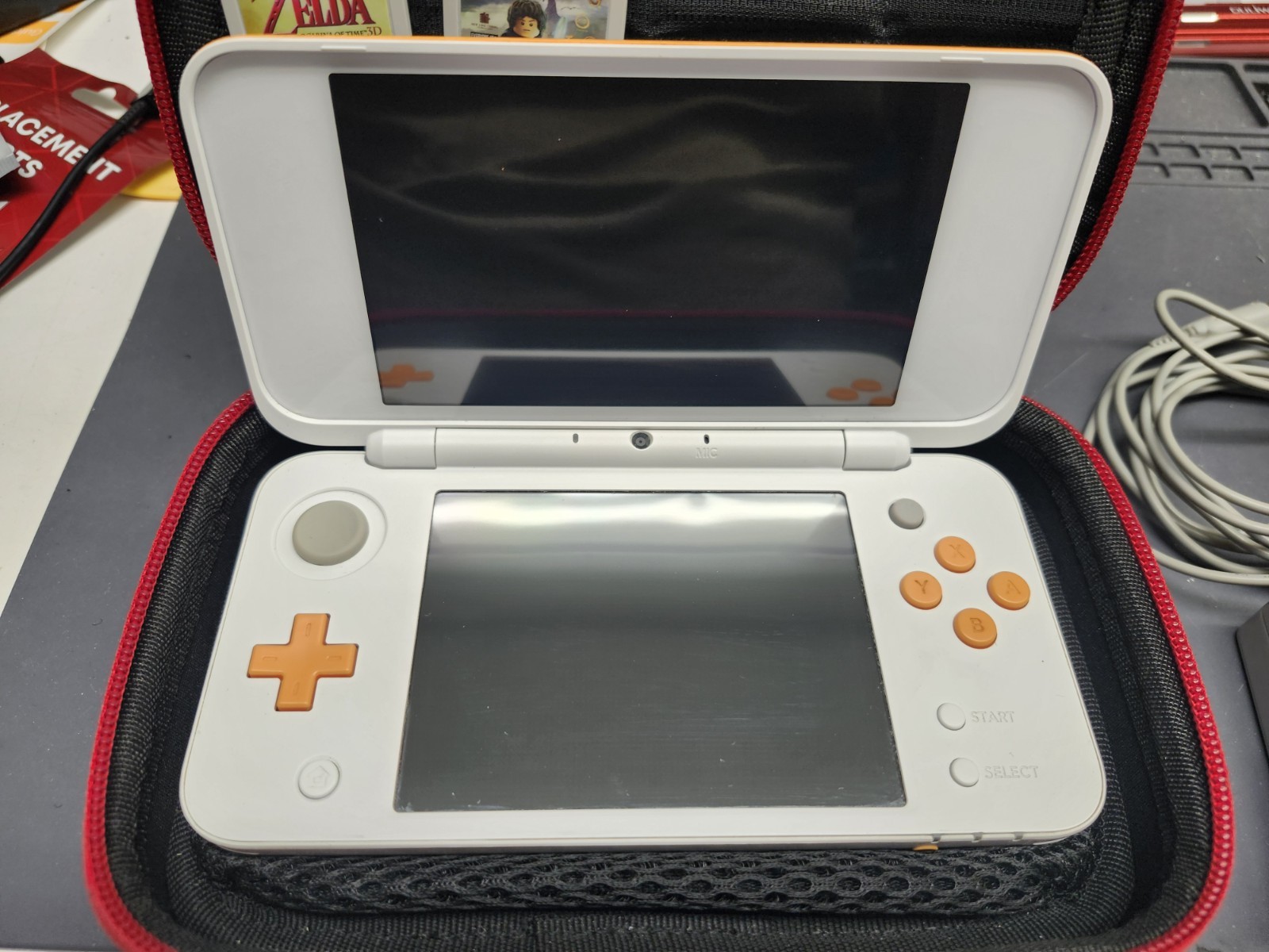 Nintendo 2DS XL Console w/ 6 games. Zelda, Starfox, LOTR & more. White & Orange
