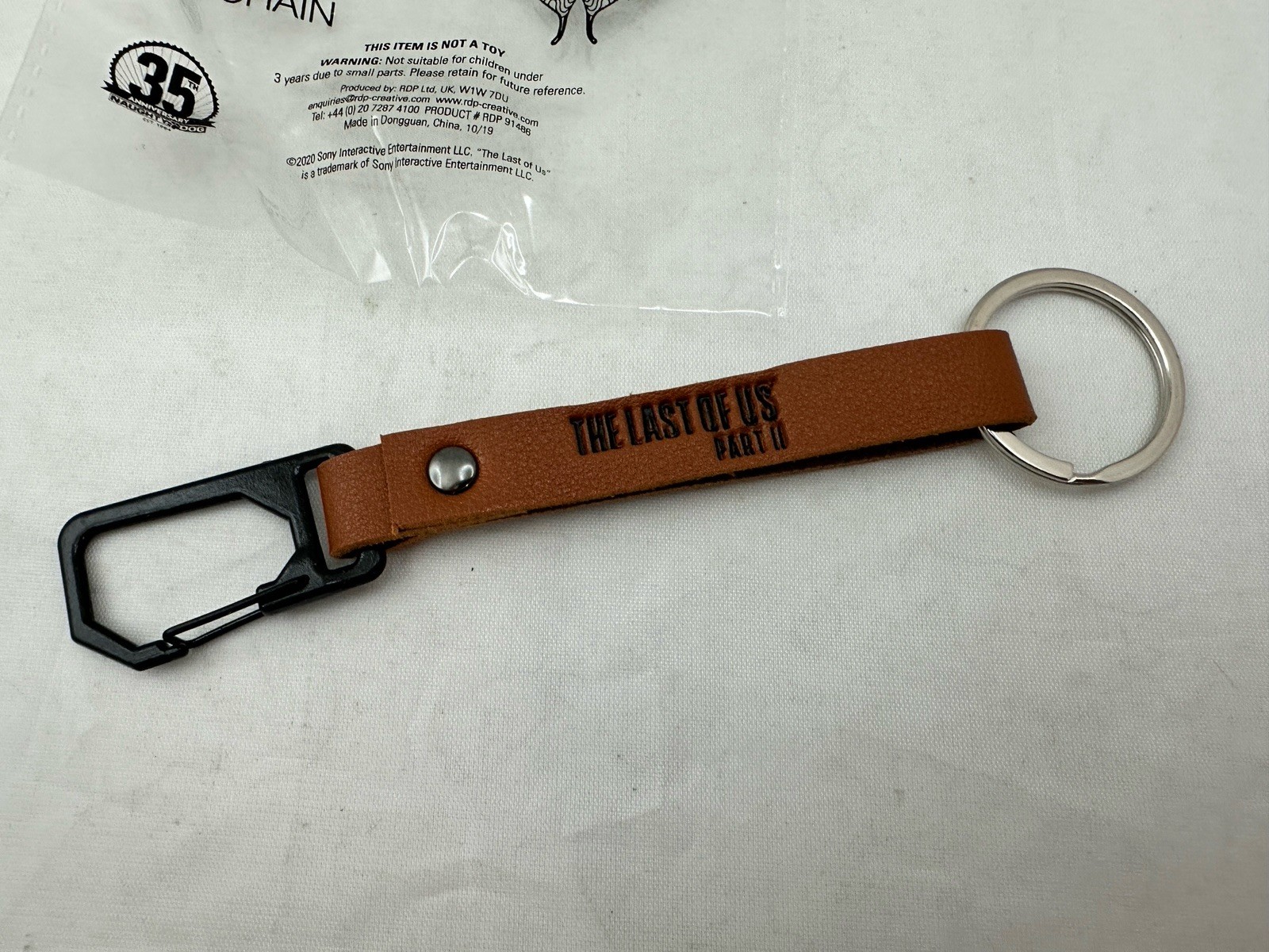 The Last of Us Part II – Promo Keychain RARE – 35th Anniversary Naughty Dog