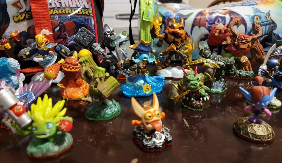 Skylanders collection of figures, 3DS games, items, vehicles, and carrying bags
