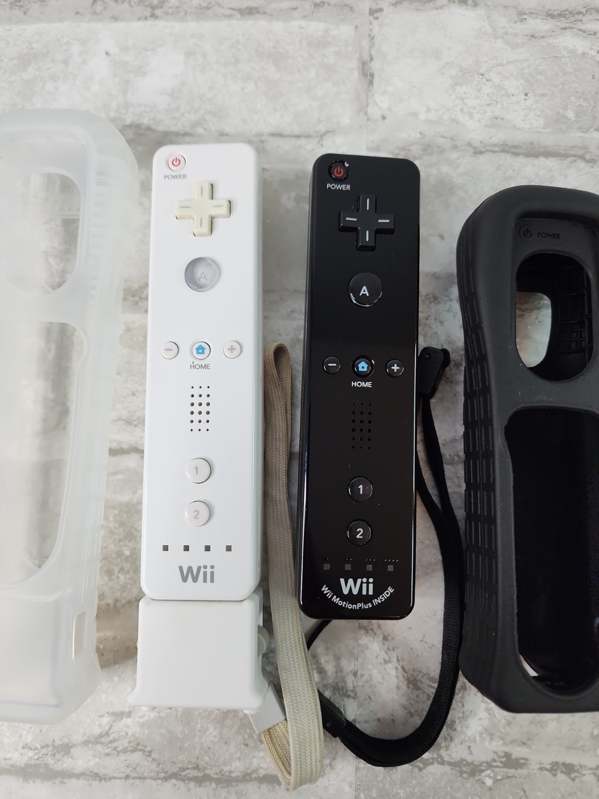 Lot Of 2 Nintendo Wii OEM Wiimotes Remotes Motion Plus Black & White w/ Covers