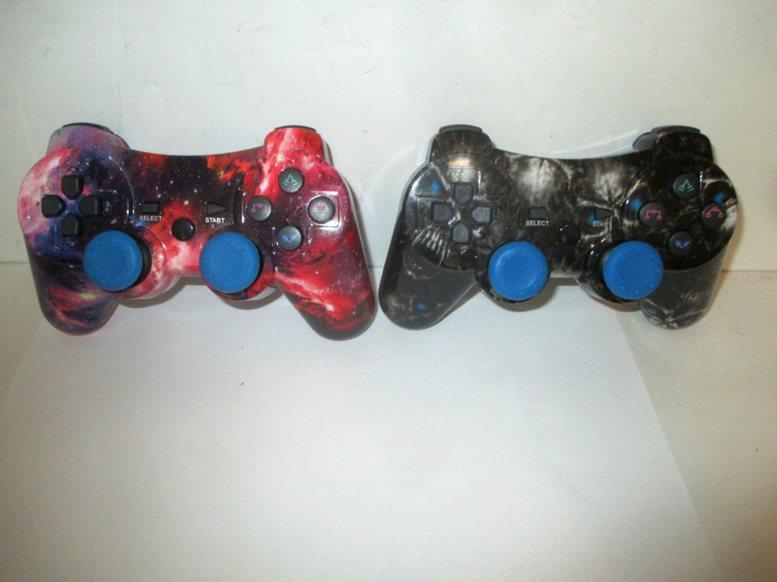 PAIR PLAYSTATION 3 PS3 3RD PARTY CONTROLLERS BLACK SKULL RED COSMOS+CORDS AS IS