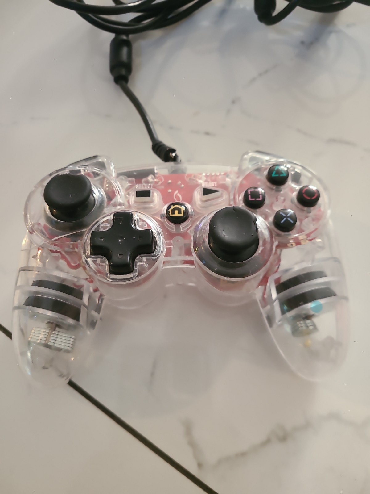 Third-party wired gaming controller for PlayStation 3, transparent pink…